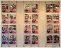 Cable pockets with lighting mounted inside onto an estate agent's wall