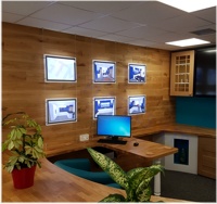 Light pockets mounted against the wall in a joinery firm's reception
