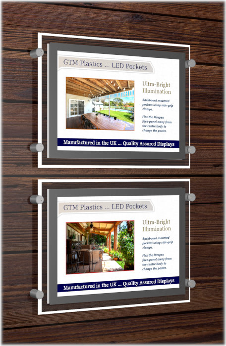 Wall mounted LED poster holder attached to a wooden backboard with side-grip clamps