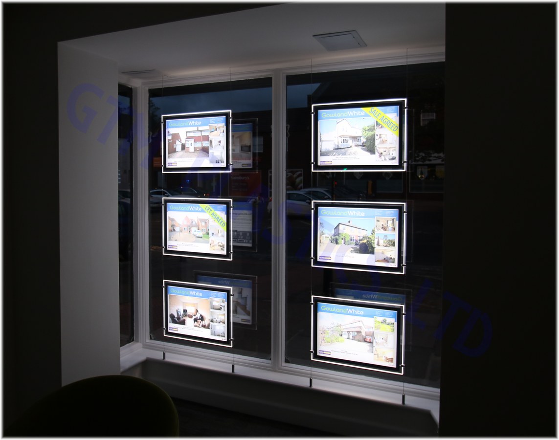 LED pockets in a letting agent's window - looking left from inside the room