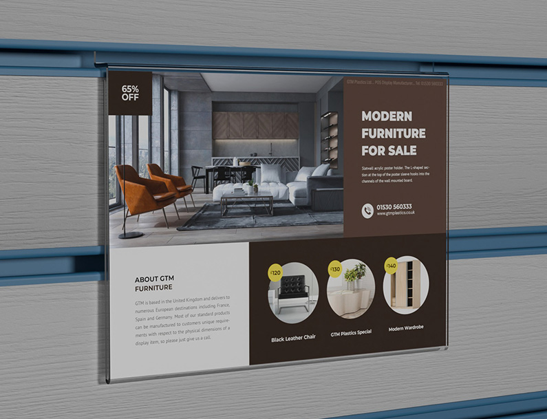 An acrylic slatwall landscape poster holder slotted into a white wooden board which has blue inserts. The poster is advertising modern furniture for sale.