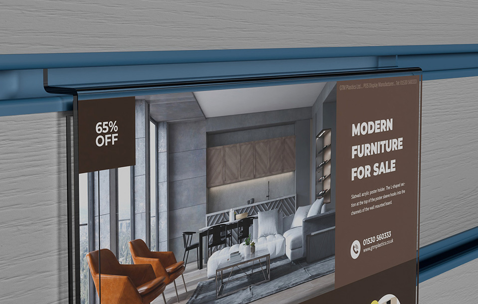 A zoomed in photo of an acrylic slatwall landscape poster holder that is advertising modern furniture for sale. The shape of the slatwall section is clearly visible.
