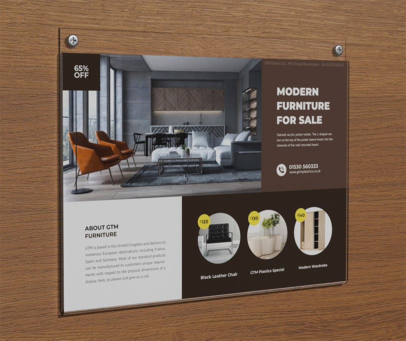 An acrylic wall mounted poster holder attached to the wall with two screws. The poster is advertising furniture for sale.
