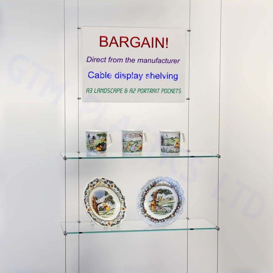 Wire hanging glass shelves with an optional poster holder between the cables