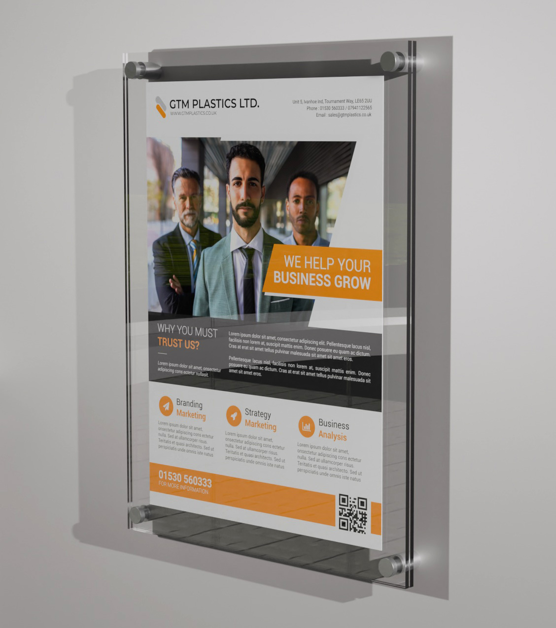 A poster sandwiched between two acrylic panels. Four stand-off clamps pass through the holes at the corners of the panels to attach the display to the wall, in portrait orientation.